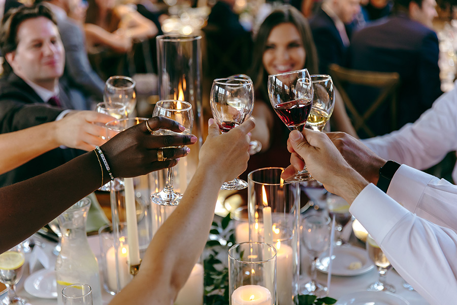 Guests raising champagne glasses for a toast at a Chicago private event